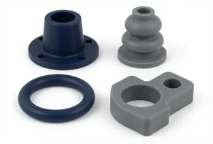 Peças técnicas em silicone (bucha, fole, anel e componente customizado) em azul escuro e cinza fabricadas pela ADGI Proquiminas